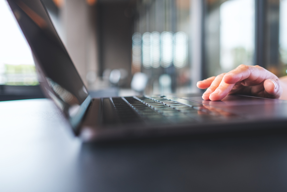 closeup-image-of-a-woman-working-and-touching-on-l-2024-12-04-09-04-15-utc-1